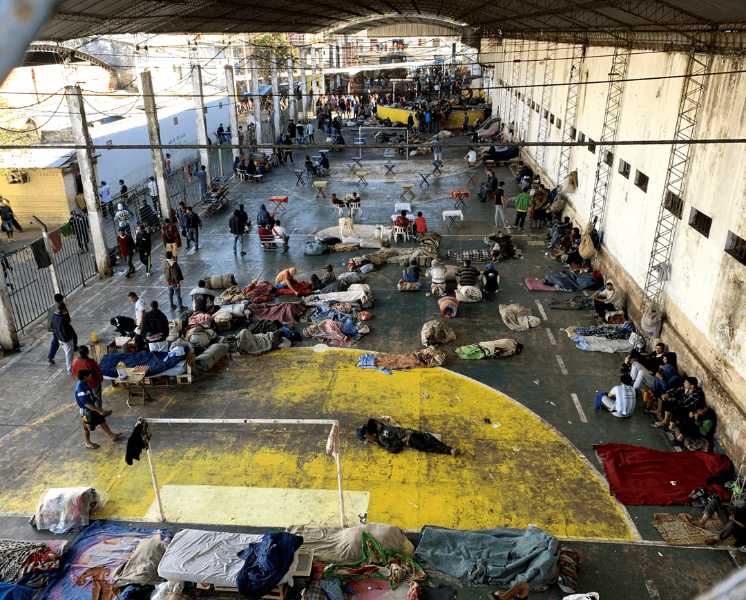 Overcrowded prison yard showing the challenging conditions