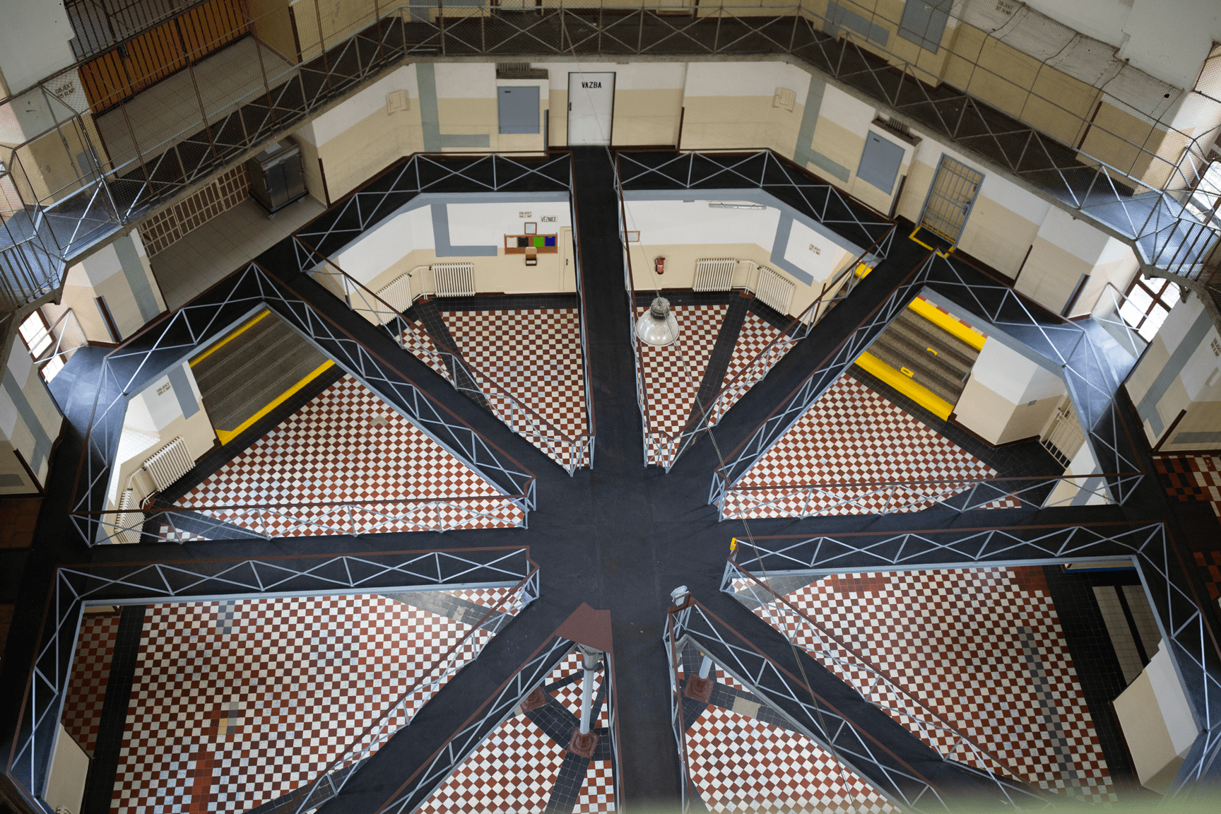 A top-down view of a panopticon-style prison, representing oversight and governance