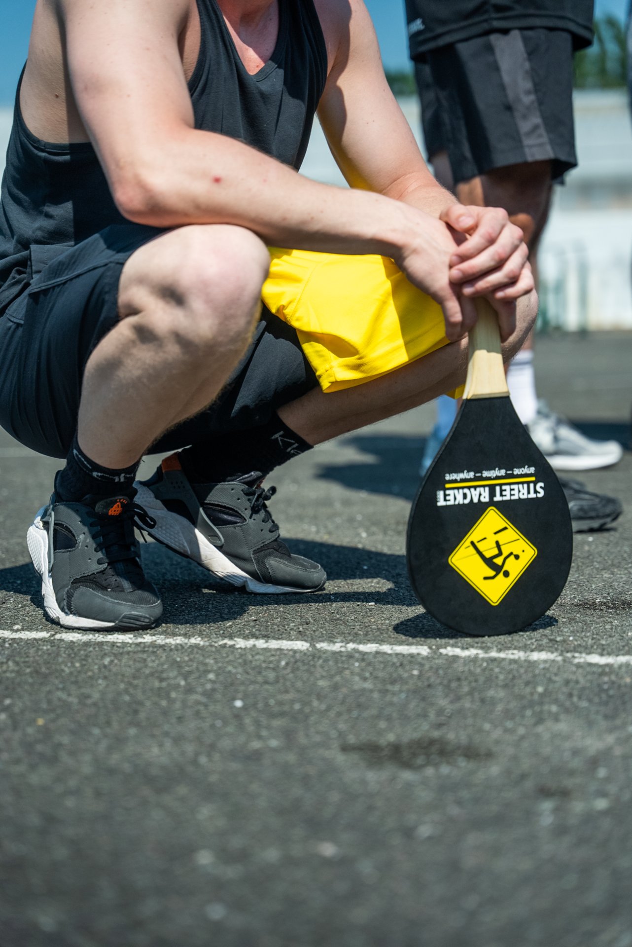Close-up of a Street Racket paddle being held by a player